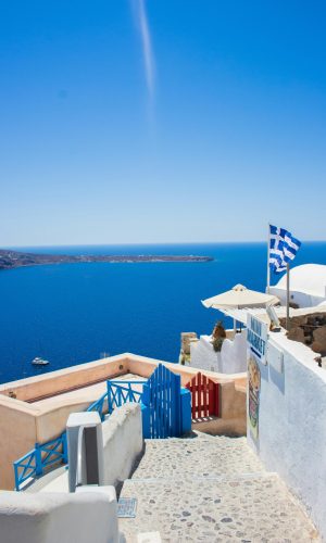 Santorini Explore the stunning blue Aegean Sea view from Santorini with Greek architecture and vibrant skies.